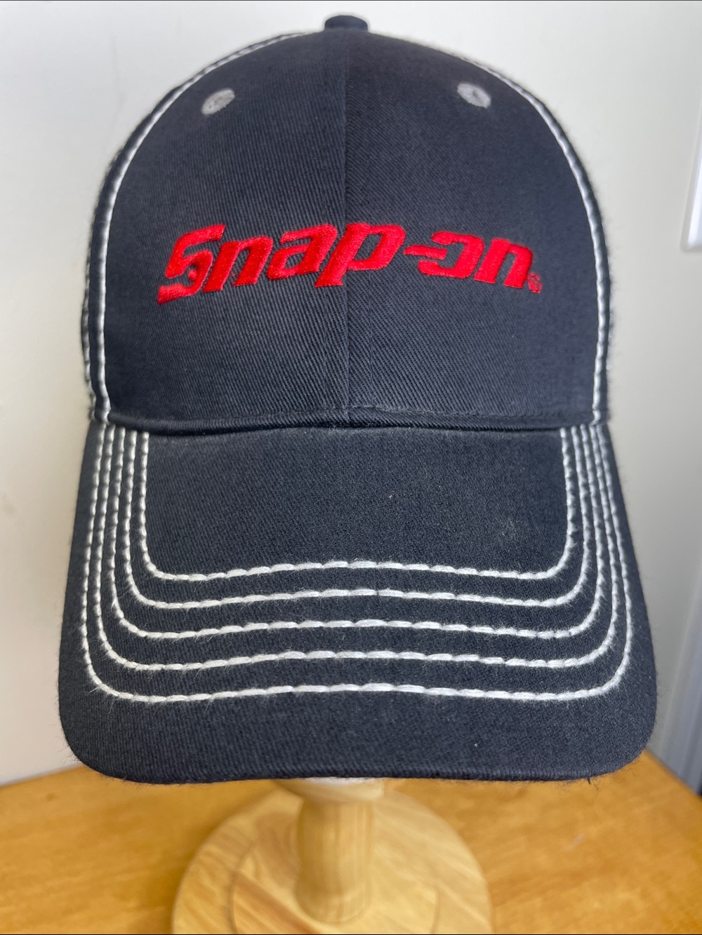 Snap-On Black Cap with Red Embroidered Logo and White Stitching